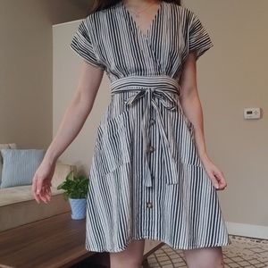An a-line dress with a waist tie and pockets